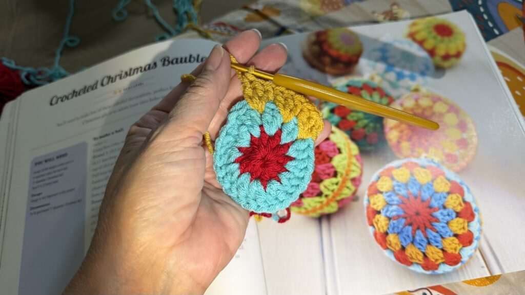 Crochet granny square Christmas ornament in progress